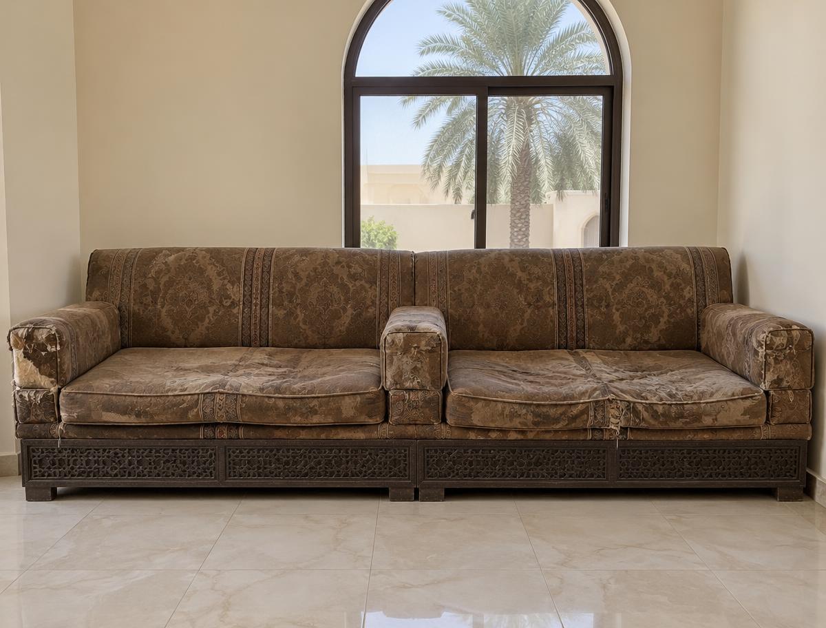 Worn sofa before reupholstery